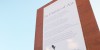 The banner 'contains microscopic pollution-eating particles of titanium dioxide'